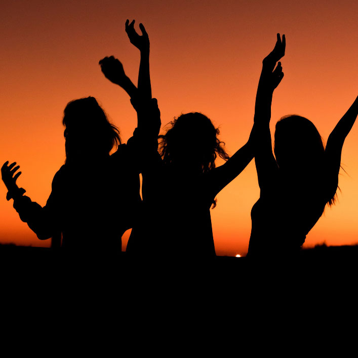 silhouette of woman on beach excited about a career change